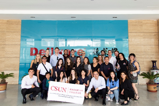 Nazarian College International Study Group students, along with Professors Tao “Eric” Hu and Kunpeng Li, gather in front of the Qingdao Dellware Refrigeration Co., Ltd entrance while holding a CSUN Nazarian College banner. (Qingdao, 2019)